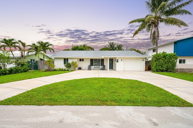 29 SE 8th Ave, Deerfield Beach, FL 33441 - ranch-style home with concrete driveway, an attached garage, and stucco siding