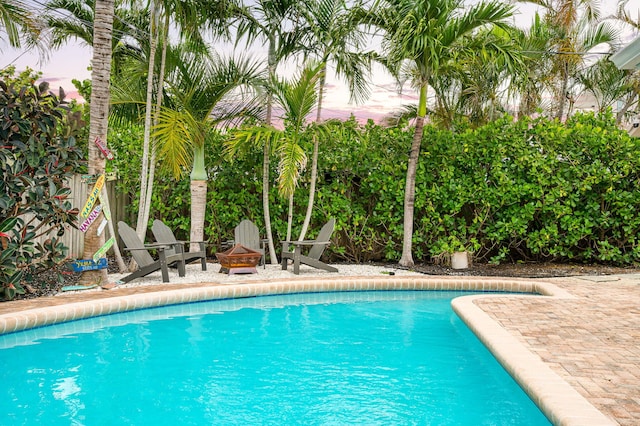 29 SE 8th Ave, Deerfield Beach, FL 33441 - outdoor pool featuring an outdoor fire pit and a patio