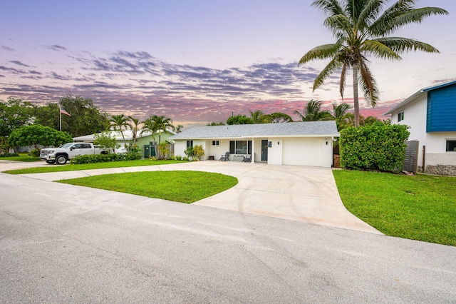 29 SE 8th Ave, Deerfield Beach, FL 33441 - single story home with concrete driveway, an attached garage, a lawn, and stucco siding