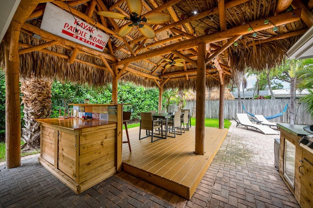 29 SE 8th Ave, Deerfield Beach, FL 33441 - wooden deck featuring a gazebo, ceiling fan, and outdoor dining space