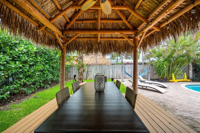 29 SE 8th Ave, Deerfield Beach, FL 33441 - wooden terrace featuring a gazebo, a fenced backyard, and outdoor dining area