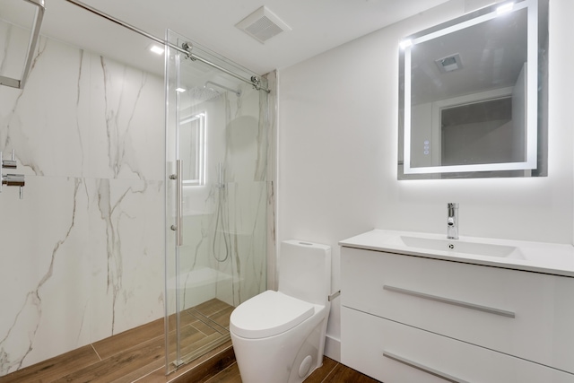 2845 SW 22nd Ave Unit 2070, Delray Beach, FL 33445 - bathroom with a marble finish shower, vanity, and wood finished floors