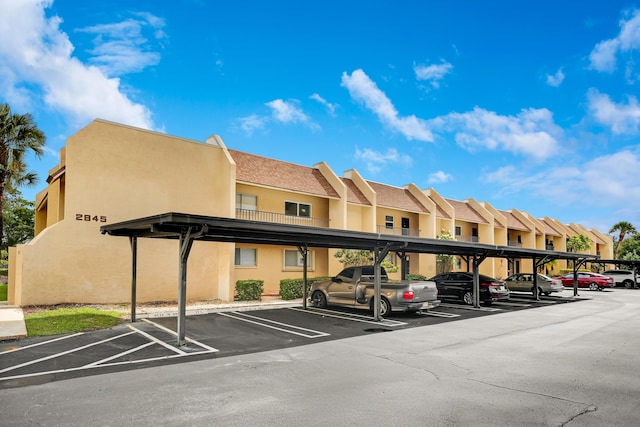 2845 SW 22nd Ave Unit 2070, Delray Beach, FL 33445 - covered parking lot with a residential view