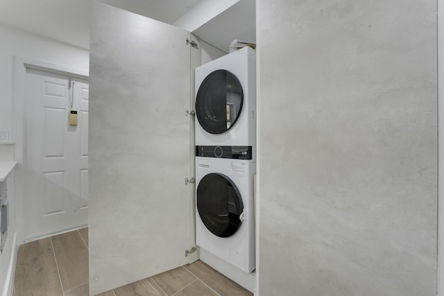 2845 SW 22nd Ave Unit 2070, Delray Beach, FL 33445 - laundry area with stacked washer / dryer and wood finish floors