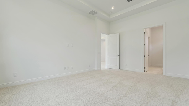 204 SE Via Sangro, Port Saint Lucie, FL 34952 - unfurnished bedroom featuring light carpet, recessed lighting, a spacious closet, and a towering ceiling