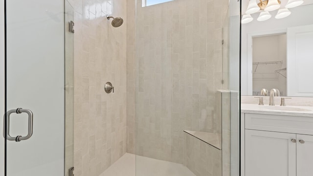 204 SE Via Sangro, Port Saint Lucie, FL 34952 - bathroom with a shower stall, vanity, and a walk in closet