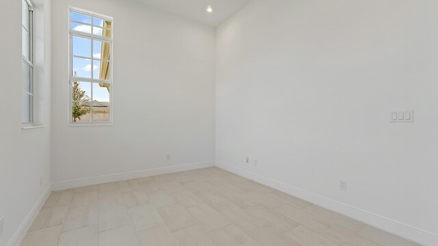 204 SE Via Sangro, Port Saint Lucie, FL 34952 - empty room featuring baseboards and recessed lighting