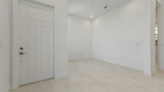 204 SE Via Sangro, Port Saint Lucie, FL 34952 - spare room with baseboards and recessed lighting