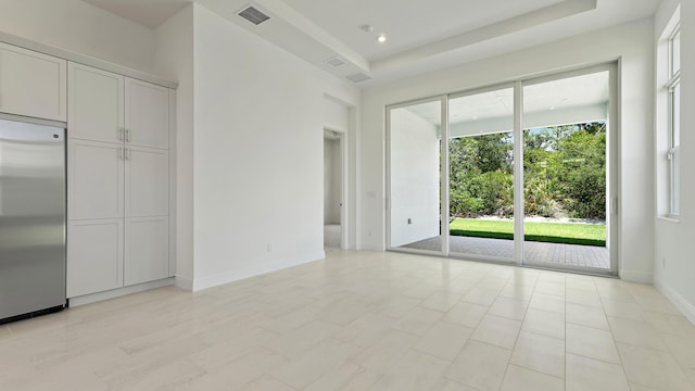 204 SE Via Sangro, Port Saint Lucie, FL 34952 - unfurnished bedroom featuring stainless steel refrigerator and access to exterior