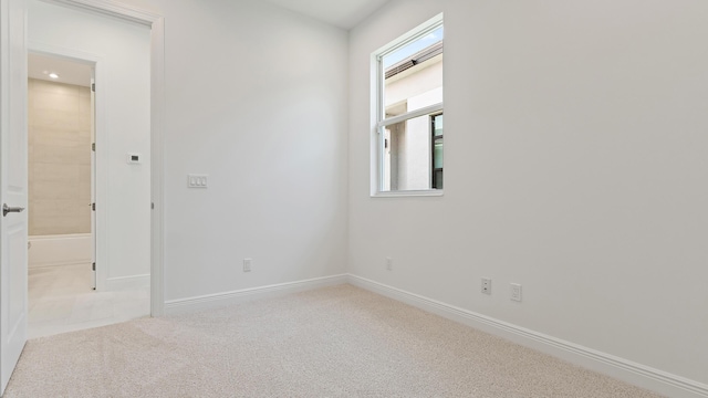 204 SE Via Sangro, Port Saint Lucie, FL 34952 - carpeted empty room featuring baseboards and recessed lighting