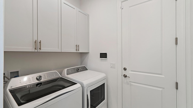 204 SE Via Sangro, Port Saint Lucie, FL 34952 - laundry room featuring cabinet space and separate washer and dryer