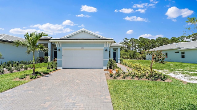 204 SE Via Sangro, Port Saint Lucie, FL 34952 - ranch-style home featuring decorative driveway, stucco siding, a front lawn, and a garage