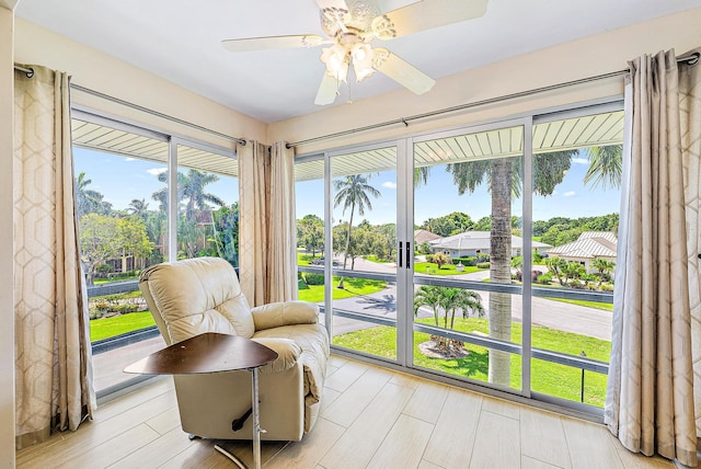 5560 Tamberlane Cir Unit 327, Palm Beach Gardens, FL 33418 - sunroom with ceiling fan and a residential view