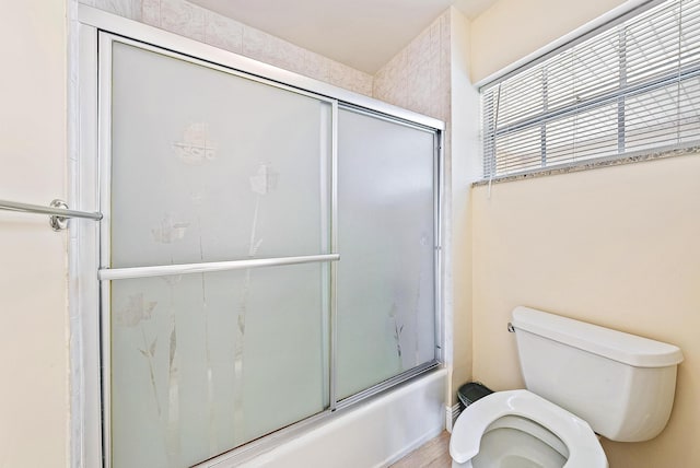 5560 Tamberlane Cir Unit 327, Palm Beach Gardens, FL 33418 - bathroom featuring toilet and enclosed tub / shower combo
