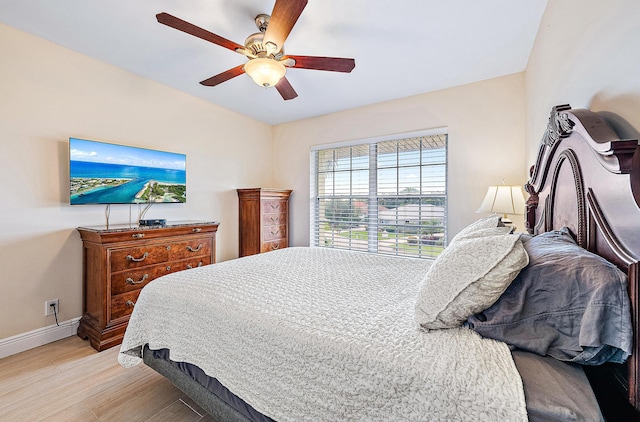 5560 Tamberlane Cir Unit 327, Palm Beach Gardens, FL 33418 - bedroom with light wood-style flooring and ceiling fan