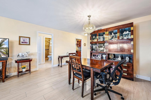 5560 Tamberlane Cir Unit 327, Palm Beach Gardens, FL 33418 - dining space featuring a chandelier and light wood finished floors