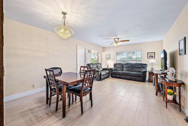 5560 Tamberlane Cir Unit 327, Palm Beach Gardens, FL 33418 - dining area with ceiling fan, light wood-type flooring, a chandelier, and arched walkways