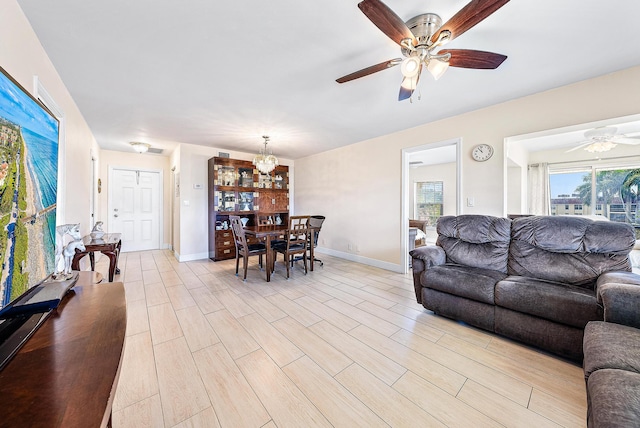 5560 Tamberlane Cir Unit 327, Palm Beach Gardens, FL 33418 - living area with ceiling fan, a chandelier, and light wood finished floors