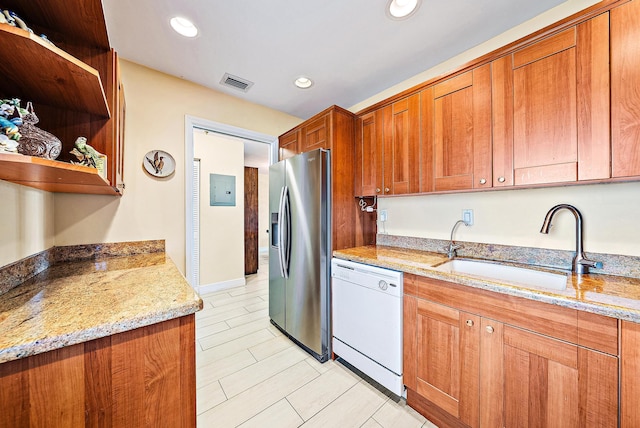 5560 Tamberlane Cir Unit 327, Palm Beach Gardens, FL 33418 - kitchen with stainless steel fridge, dishwasher, electric panel, brown cabinetry, and recessed lighting