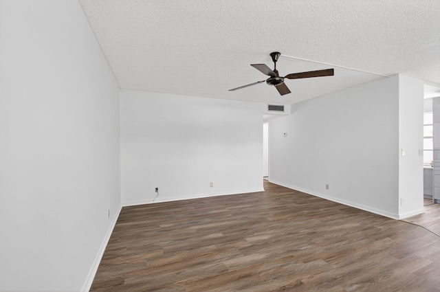 102 Normandy Ln Unit C, Delray Beach, FL 33484 - unfurnished room with a textured ceiling, a ceiling fan, and wood finished floors
