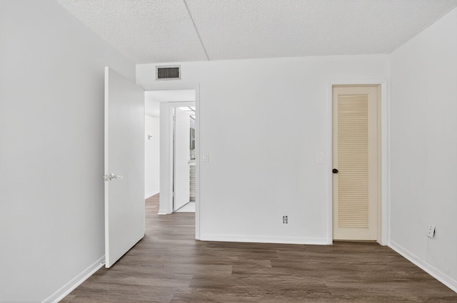 102 Normandy Ln Unit C, Delray Beach, FL 33484 - empty room featuring wood finished floors and a textured ceiling