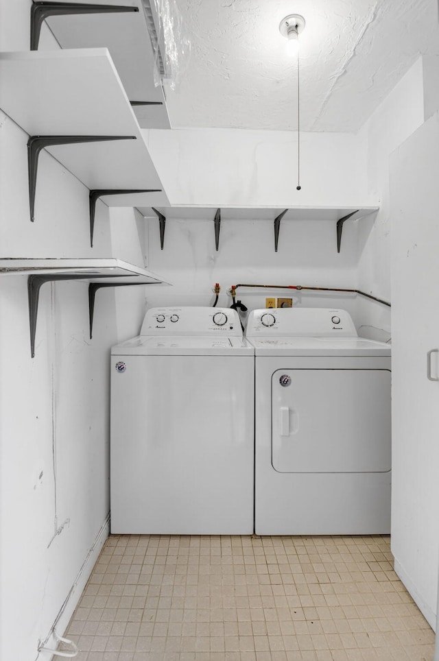 102 Normandy Ln Unit C, Delray Beach, FL 33484 - laundry area featuring washer and dryer and baseboards