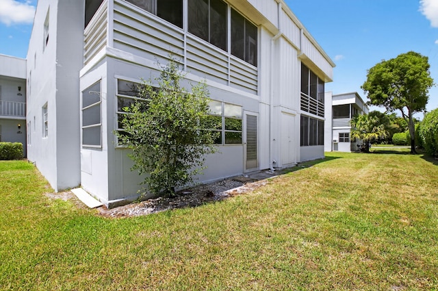 102 Normandy Ln Unit C, Delray Beach, FL 33484 - view of side of property with a yard