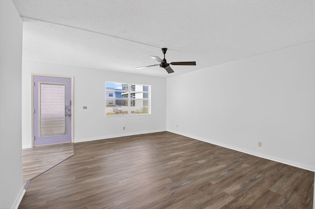102 Normandy Ln Unit C, Delray Beach, FL 33484 - spare room featuring a ceiling fan, dark wood-style flooring, and a textured ceiling