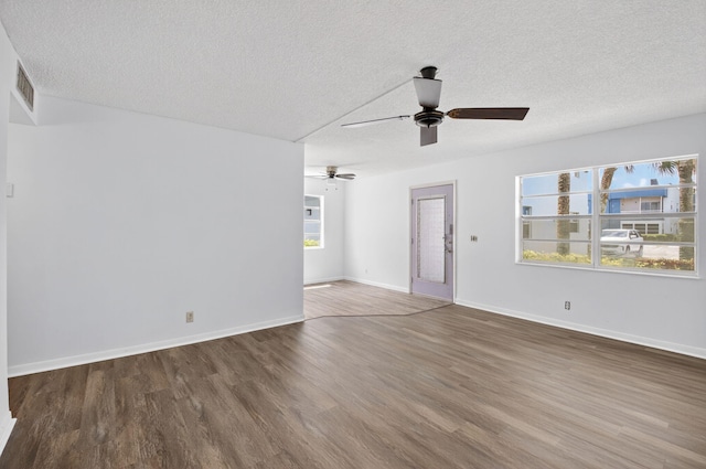 102 Normandy Ln Unit C, Delray Beach, FL 33484 - empty room with ceiling fan, wood finished floors, and a textured ceiling