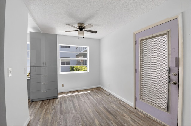 102 Normandy Ln Unit C, Delray Beach, FL 33484 - unfurnished room with ceiling fan, wood finished floors, and a textured ceiling