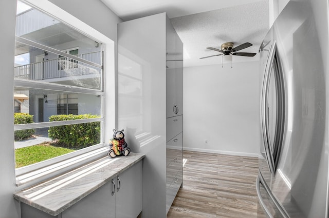 102 Normandy Ln Unit C, Delray Beach, FL 33484 - corridor with light wood-type flooring and a textured ceiling