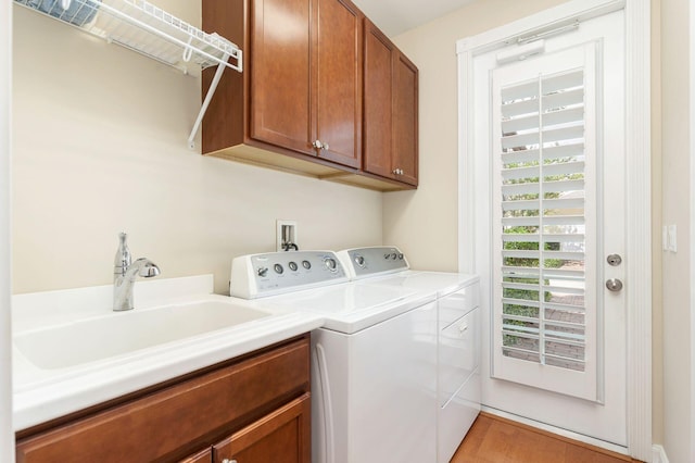 3330 W Mallory Blvd, Jupiter, FL 33458 - laundry room featuring independent washer and dryer and cabinet space