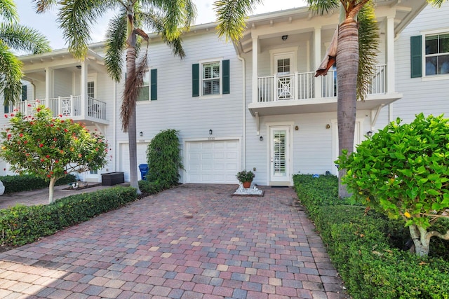 3330 W Mallory Blvd, Jupiter, FL 33458 - townhome / multi-family property featuring decorative driveway and an attached garage