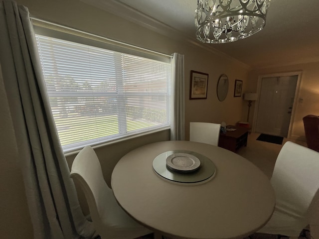 291 Saxony Unit G, Delray Beach, FL 33446 - dining room with a chandelier and ornamental molding