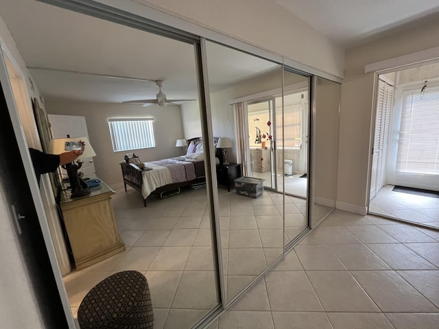 291 Saxony Unit G, Delray Beach, FL 33446 - bedroom with light tile patterned floors, a closet, and ceiling fan
