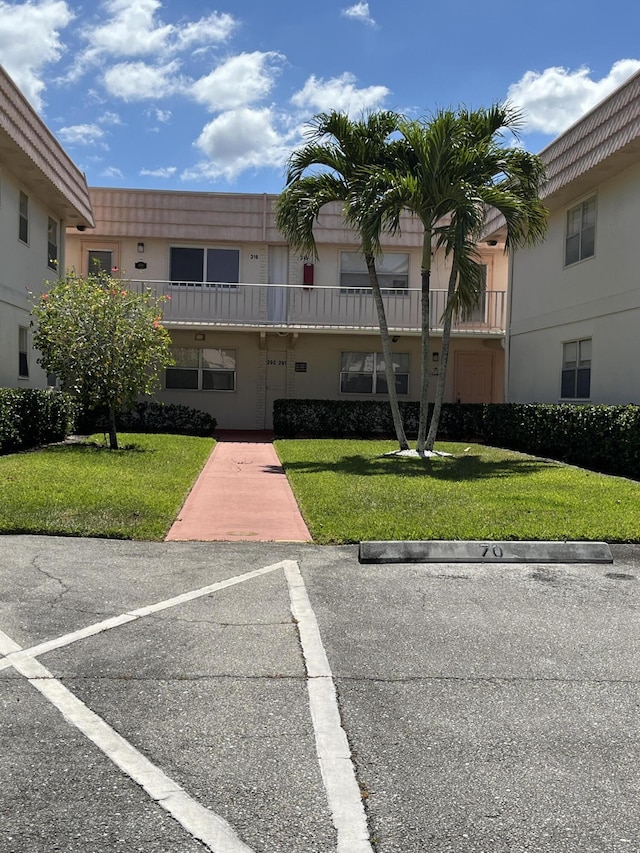 291 Saxony Unit G, Delray Beach, FL 33446 - view of building exterior with uncovered parking
