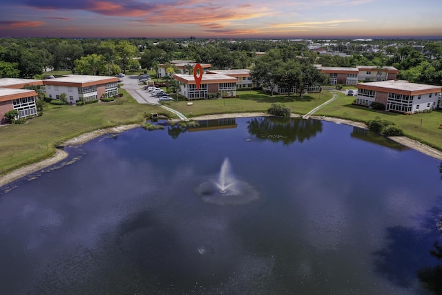 1225 NW 21st St Unit 3701, Stuart, FL 34994 - aerial view at dusk of a water view and a view of apartment building / complex