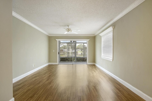 1225 NW 21st St Unit 3701, Stuart, FL 34994 - spare room with wood finished floors, a ceiling fan, a textured ceiling, and ornamental molding