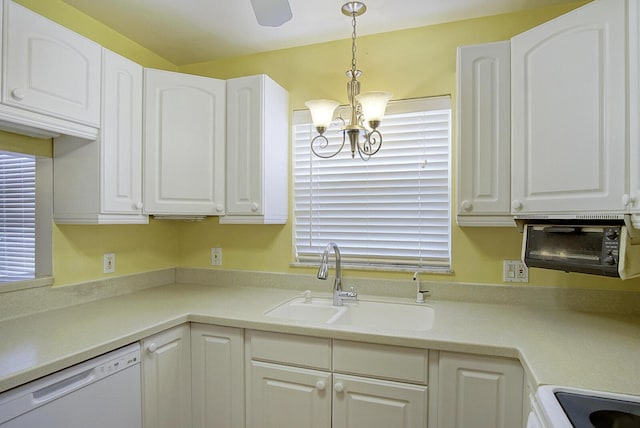 1225 NW 21st St Unit 3701, Stuart, FL 34994 - kitchen featuring dishwasher, a chandelier, white cabinetry, hanging light fixtures, and light countertops