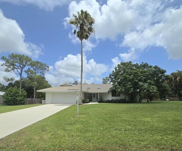 1680 SW Belgrave Ter, Stuart, FL 34997 - view of front of property with driveway and an attached garage
