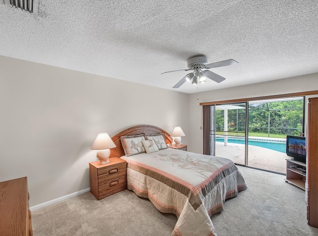 1680 SW Belgrave Ter, Stuart, FL 34997 - bedroom with access to outside, light colored carpet, ceiling fan, and a textured ceiling