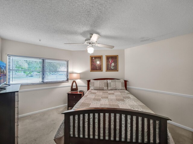 1680 SW Belgrave Ter, Stuart, FL 34997 - bedroom with carpet floors, a textured ceiling, and ceiling fan