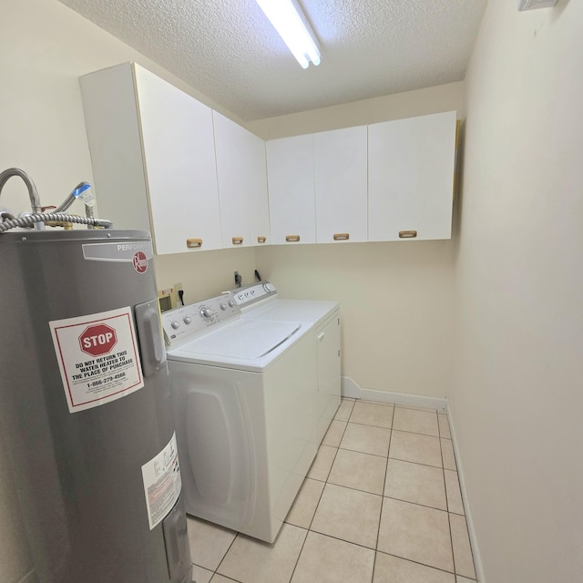 1680 SW Belgrave Ter, Stuart, FL 34997 - laundry room featuring cabinet space, water heater, washer and dryer, a textured ceiling, and light tile patterned floors