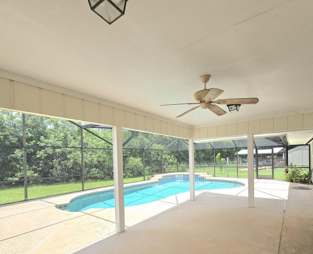 1680 SW Belgrave Ter, Stuart, FL 34997 - outdoor pool featuring a patio area, a lanai, a lawn, and ceiling fan