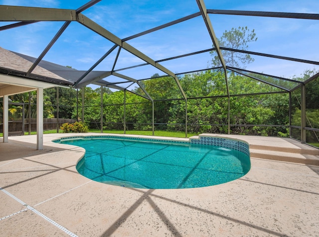 1680 SW Belgrave Ter, Stuart, FL 34997 - outdoor pool with a patio and glass enclosure