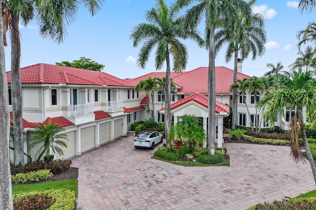 3643 Princeton Pl, Boca Raton, FL 33496 - view of front facade featuring decorative driveway, a tiled roof, a balcony, and stucco siding