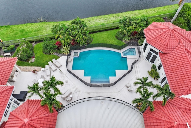 3643 Princeton Pl, Boca Raton, FL 33496 - view of swimming pool featuring a fenced backyard, a water view, and a pool with connected hot tub