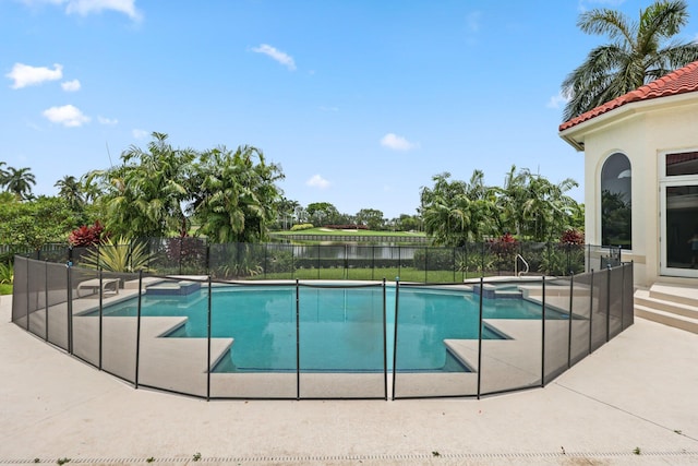 3643 Princeton Pl, Boca Raton, FL 33496 - view of pool with a pool with connected hot tub, a water view, a patio area, and a fenced backyard
