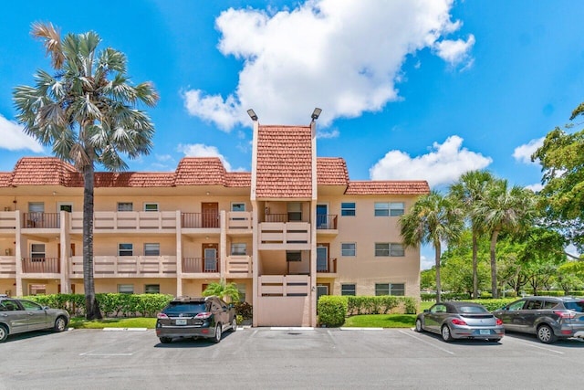 14721 Bonaire Blvd Unit 101, Delray Beach, FL 33446 - view of building exterior featuring uncovered parking