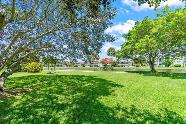 14721 Bonaire Blvd Unit 101, Delray Beach, FL 33446 - view of grassy yard featuring a water view